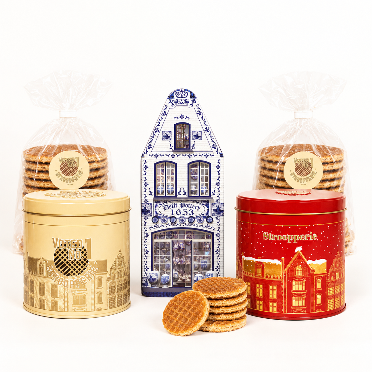 Stroopperie Mixed Heritage Trio with beige tin, red tin, Delft Blue house, and stroopwafels